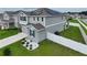 Two-story house with solar panels and fenced backyard at 592 Lake Smart Blvd, Winter Haven, FL 33881