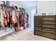 Large walk-in closet with ample hanging space and shelving at 592 Lake Smart Blvd, Winter Haven, FL 33881