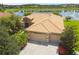 Single-Gathering house with tile roof and attached two-car garage at 154 Rancho Mirage Dr, Kissimmee, FL 34759