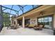 Relaxing covered patio with seating area, creating an outdoor oasis at 154 Rancho Mirage Dr, Kissimmee, FL 34759