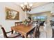 Bright dining room with wood table and view into living room at 154 Rancho Mirage Dr, Kissimmee, FL 34759