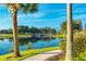 Scenic walkway along the lake with a stone bridge at 154 Rancho Mirage Dr, Kissimmee, FL 34759