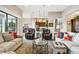 Living room with comfortable seating and open view to kitchen at 154 Rancho Mirage Dr, Kissimmee, FL 34759
