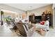 Open living room with seating area and view into dining area at 154 Rancho Mirage Dr, Kissimmee, FL 34759