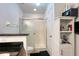 Bathroom with glass door shower, vanity with granite countertop, and white cabinet at 721 Interlude Ln # 105, Orlando, FL 32824