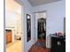 Bright bathroom and closet space with hardwood flooring and a view of full sized mirror at 721 Interlude Ln # 105, Orlando, FL 32824