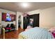 Cozy bedroom with a large bed, TV, and closet at 721 Interlude Ln # 105, Orlando, FL 32824