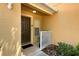 Charming home entrance with dark wood door, small window, and room for a small bench at 721 Interlude Ln # 105, Orlando, FL 32824