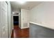 Upstairs hallway with hardwood floors and multiple doors at 721 Interlude Ln # 105, Orlando, FL 32824
