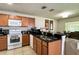 Bright kitchen with granite counters, stainless steel appliances and lots of cabinet space at 721 Interlude Ln # 105, Orlando, FL 32824