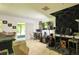 An open living room space with tile flooring, light walls and a screened-in outdoor patio at 721 Interlude Ln # 105, Orlando, FL 32824