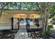 Community pool gated entrance with rules and accessibility signs near mature trees at 721 Interlude Ln # 105, Orlando, FL 32824