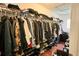 A walk-in closet featuring ample storage space for clothes, shoes, and other personal items at 721 Interlude Ln # 105, Orlando, FL 32824