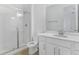 Clean bathroom featuring a shower, toilet, and vanity with a mirror at 907 Heirloom Dr, Haines City, FL 33844