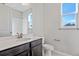 Bathroom with dark vanity, white countertop, and a shower at 911 Heirloom Dr, Haines City, FL 33844