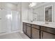 Bathroom boasts double vanity and walk-in shower at 911 Heirloom Dr, Haines City, FL 33844