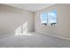 Bright bedroom with carpeted floor and large window at 911 Heirloom Dr, Haines City, FL 33844