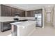 Modern kitchen with stainless steel appliances and an island at 911 Heirloom Dr, Haines City, FL 33844