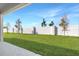 Private backyard with grassy area and a fence at 930 Heirloom Dr, Haines City, FL 33844