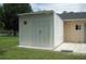 White storage shed in the backyard at 267 Cranbrook Dr, Kissimmee, FL 34758