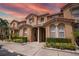 Charming townhomes feature well-maintained landscaping and a beautiful terracotta-tiled roof at 5520 Paradise Cay Cir, Kissimmee, FL 34746