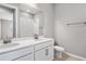 Modern bathroom with double vanity and mirror at 1706 Sugarbelle Cir, Mascotte, FL 34753