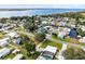 Picturesque aerial view of waterfront properties, perfect for boating and enjoying lakeside living at 435 Lantern Dr, Kenansville, FL 34739