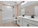 Bathroom features a double vanity and a bathtub at 1446 Maddie Berry Ln, Kissimmee, FL 34744