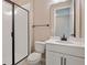 Bathroom features a large shower and modern white vanity at 1446 Maddie Berry Ln, Kissimmee, FL 34744