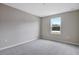 Bright bedroom with a single window and neutral wall colors at 1446 Maddie Berry Ln, Kissimmee, FL 34744