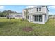 View of two-story home from the backyard at 1446 Maddie Berry Ln, Kissimmee, FL 34744