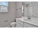 Bathroom with white vanity, single sink, and a shower with tiled walls at 830 Ballantyne Dr, Lake Wales, FL 33898