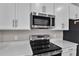 Stainless steel range and microwave in a modern kitchen at 830 Ballantyne Dr, Lake Wales, FL 33898
