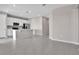 Modern kitchen with white cabinets, stainless steel appliances, and large island at 830 Ballantyne Dr, Lake Wales, FL 33898