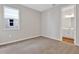 Bedroom with neutral carpet and an adjacent bathroom at 926 Heirloom Dr, Haines City, FL 33844