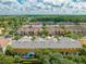 Wide aerial view of multiple townhouses in community at 9532 Silver Buttonwood St, Orlando, FL 32832