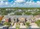 Aerial view of row of townhouses with garages at 9532 Silver Buttonwood St, Orlando, FL 32832