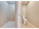 Bathroom with a shower and toilet at 9532 Silver Buttonwood St, Orlando, FL 32832