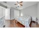 Bedroom with wood floors and ceiling fan at 9532 Silver Buttonwood St, Orlando, FL 32832