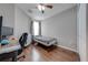Well-lit bedroom featuring wood floors and built-in workspace at 9532 Silver Buttonwood St, Orlando, FL 32832