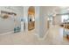 Light and airy entryway with tile floors and kitchen views at 9532 Silver Buttonwood St, Orlando, FL 32832