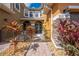 Attractive walkway to front door with black wrought iron gate at 9532 Silver Buttonwood St, Orlando, FL 32832