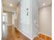 Upstairs hallway with wood flooring and access to bedrooms at 9532 Silver Buttonwood St, Orlando, FL 32832