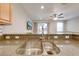 Double stainless steel sink with modern faucet in kitchen at 9532 Silver Buttonwood St, Orlando, FL 32832