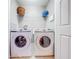 Laundry room with side-by-side washer and dryer at 9532 Silver Buttonwood St, Orlando, FL 32832
