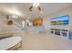 Open living area with a sectional sofa and large flat-screen TV at 9532 Silver Buttonwood St, Orlando, FL 32832