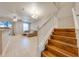 Bright living room with tile floors, staircase, and comfortable seating at 9532 Silver Buttonwood St, Orlando, FL 32832