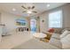 Open concept living room and kitchen with neutral decor at 9532 Silver Buttonwood St, Orlando, FL 32832