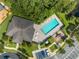 Aerial view of community pool, playground, and clubhouse at 9532 Silver Buttonwood St, Orlando, FL 32832