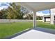 Covered patio overlooking a spacious backyard at 1416 Maddie Berry Ln, Kissimmee, FL 34744